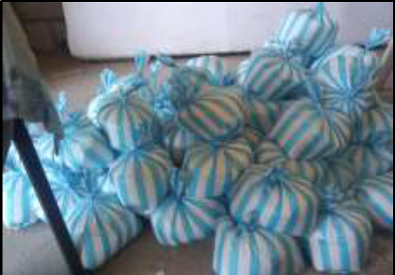Bags of laundry soap ready for distribution