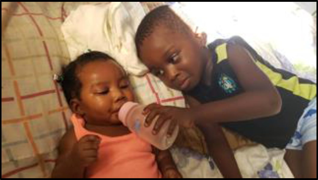 Zeke loves his baby sister!