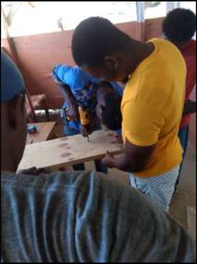 Participants in the bench building class learn the nuances of measuring, cutting, drilling, and assembling to create fine furniture.