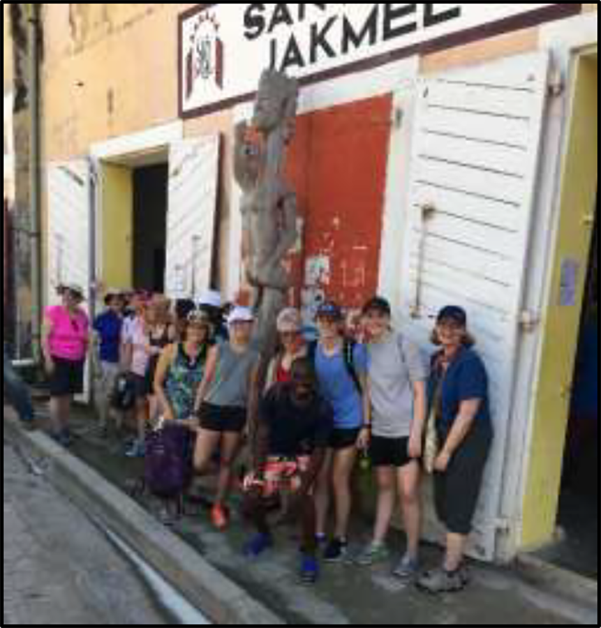 A prior mission trip group exploring the arts and culture of Jacmel