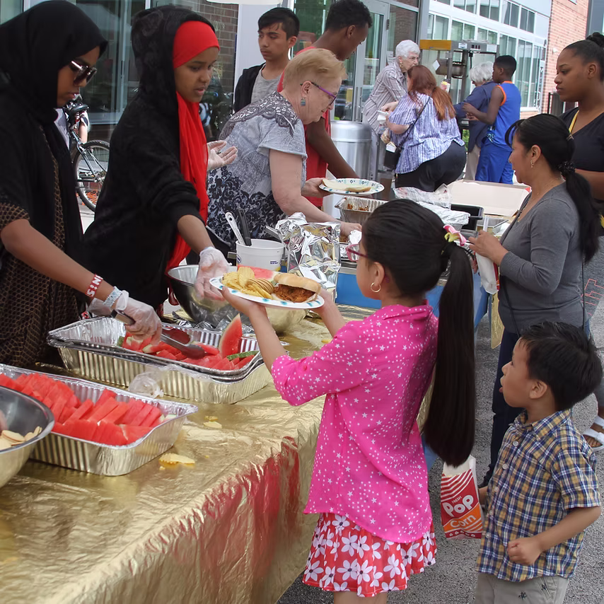 People serving food at Messiah Lutheran church
