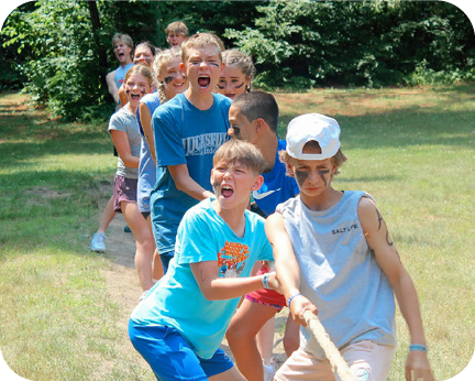 camp kids playing tug of war